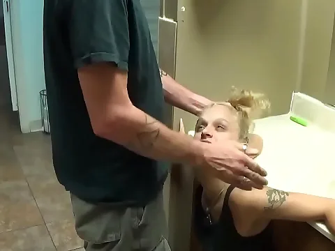 A petite teen entered the public bathroom, feeling uneasy.