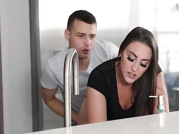 A busty natural stepmom, Melanie Hicks, gets stuck in the kitchen and makes a