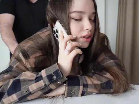 Fucking my stepsister while she's on the phone.